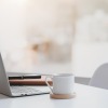 desk with laptop and coffee mug