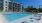 pool with white lounge chairs
